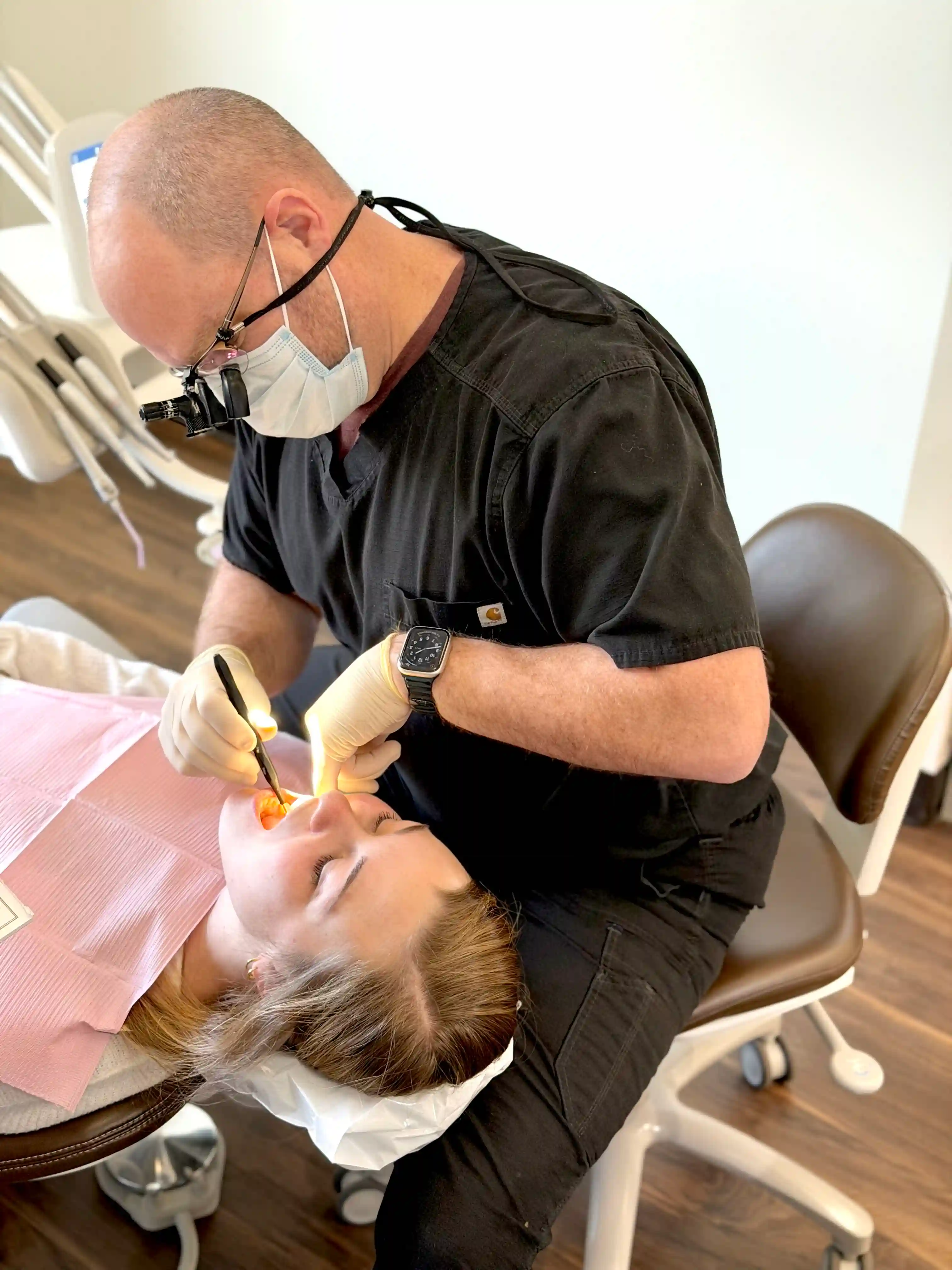 Dr. Nate Henderson performing a dental exam at Harrison Family Dentistry in Chattanooga, TN